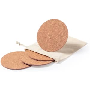 A set of round cork coasters in a natural colour, packaged in a drawstring bag.