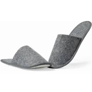 A pair of grey felt slippers with a soft lining, featuring a slip-on design and rounded toes.