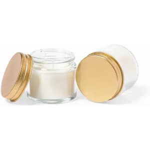 A clear glass jar with a gold lid, containing a white substance, displayed next to another identical jar.