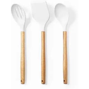 A set of three kitchen utensils with white silicone heads and wooden handles.