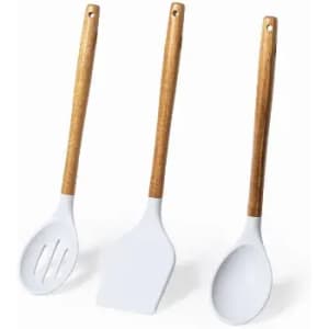 A set of three cooking utensils with white silicone heads and wooden handles, arranged side by side.