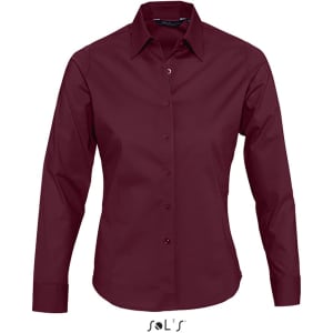 A burgundy long sleeve women's shirt with a button-down front and collar, featuring a logo.