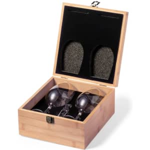 A wooden gift box containing two elegant glasses, secured with a soft lining for protection.
