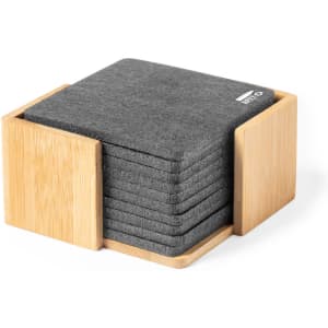 A set of grey felt coasters stacked in a bamboo holder. The holder has an open design for easy access.
