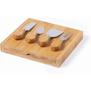 A wooden cheese board featuring four silver cheese tools with wooden handles.