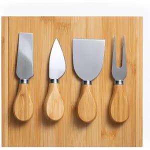 A set of four stainless steel garden tools with bamboo handles, displayed on a wooden board.