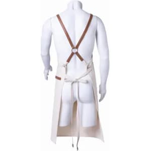 A cream-coloured apron with brown straps, featuring a stitched pocket and a tie at the waist.