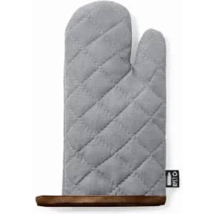 A grey oven mitt with a quilted pattern and a wooden holder. It has a logo on the side.