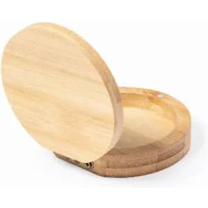 A bamboo compact mirror with a circular design, featuring a smooth, natural finish. It has a simple hinge mechanism.