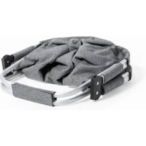 A portable grey camper chair with a foldable metal frame, featuring padded handles for comfort.
