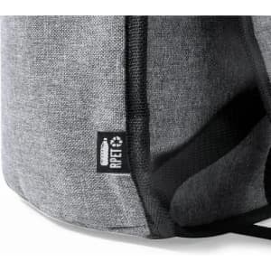 A grey fabric bag with a textured surface and a black logo label. Features black straps.