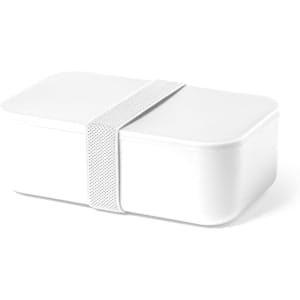 A white lunch box with a fitted lid, secured by a textured elastic band.