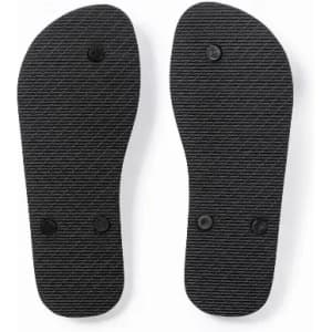 A pair of black flip flop soles with a textured surface and two circular bumps on each sole.