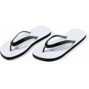 A pair of flip-flops featuring a white footbed and black straps. They have a minimalist design.