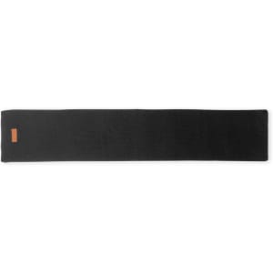 A black yoga mat featuring a minimalistic design and a small logo at one end.