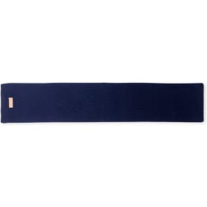 A floor mat in a deep navy blue, featuring a minimalist design with a small logo.