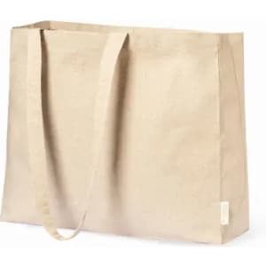 A tote bag in a light beige colour with long handles and a simple, minimalist design. It features a tag but no visible branding.