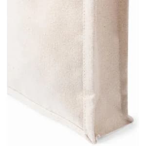 A natural, textured bag in a light beige colour with a structured design, featuring visible stitching details.