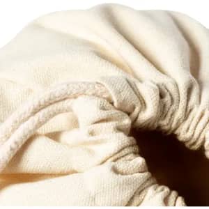 A cotton drawstring bag in a natural beige shade, featuring a gathered top with a pull cord.