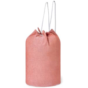 A drawstring bag in a soft coral colour, featuring a simple design and white straps.