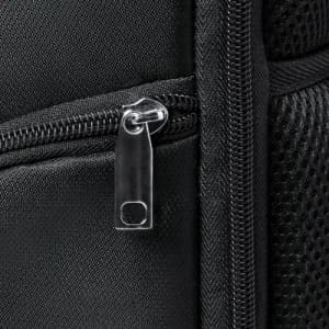 A close-up of a black zippered bag, featuring a sleek metal zipper and textured fabric.