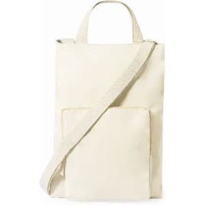 A cream-coloured tote bag with a shoulder strap and a front pocket, featuring a logo.