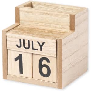 A wooden perpetual calendar featuring blocks for the month and day. The structure has a natural wood finish.