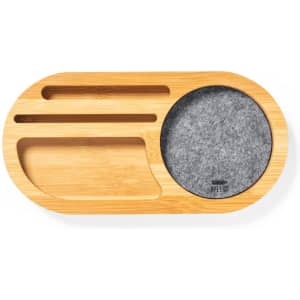 A bamboo organiser with a felt compartment, featuring grooves for holding items. It has a natural wood finish.