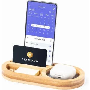 A bamboo organiser featuring a phone holder, a space for AirPods, and a slot for a card.