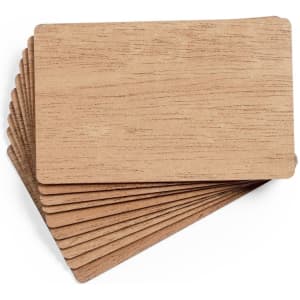 A stack of wooden business cards, featuring a light wood finish with smooth edges.