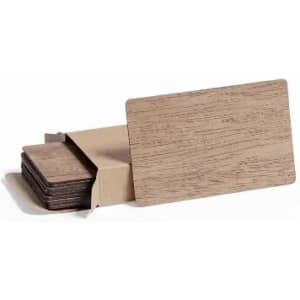 A set of wooden coasters stacked in a box, featuring a natural brown finish. The box is partially open.