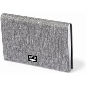 A grey notebook with a textured cover, featuring a small logo on the front.