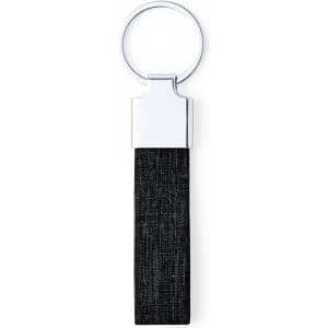 A keyring featuring a silver metal ring and a black fabric strap. The design is simple and modern.