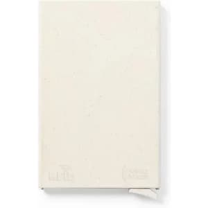 A notebook with a textured cream cover and a ribbon bookmark. It features a logo on the lower right corner.