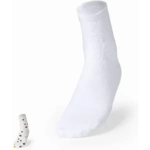 A pair of white socks with a single patterned sock displayed beside them. The patterned sock features black dots.