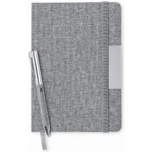 A grey notebook with a textured cover and a pen resting beside it. The notebook features an elastic closure and a pocket.
