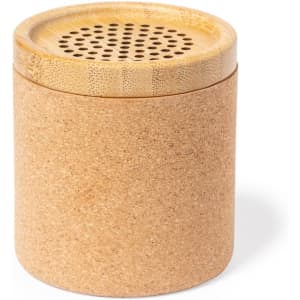 A cork container with a bamboo lid featuring ventilation holes. The natural tones create an earthy aesthetic.