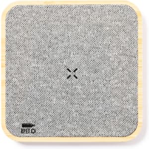 A square coasters made of grey fabric with a bamboo base, featuring a logo.