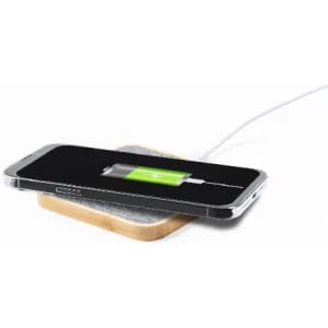 A wireless charger with a wooden base and a phone placed on it, displaying a charging battery icon.