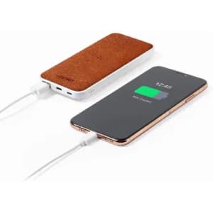 A power bank with a brown leather texture beside a smartphone displaying a charging icon.