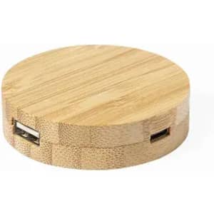 A round bamboo charging station featuring two USB ports, showcasing a natural wood finish.