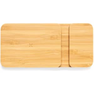 A set of bamboo chopping boards in rectangular and square shapes, showcasing natural wood grain texture.