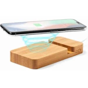 A wireless phone charger with a bamboo base and a phone hovering above, surrounded by a blue light effect.