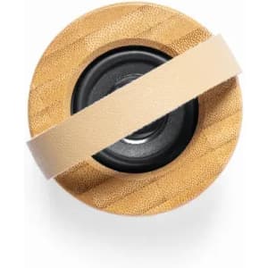 A drink bottle with a bamboo exterior, featuring a black base and a cream-coloured strap.