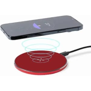 A wireless charger in red with a mobile phone above it, displaying charging signals.