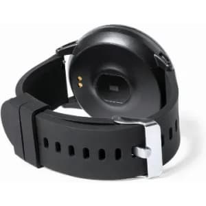 A black fitness watch with a rubber strap, featuring a silver buckle and a round watch face, displaying sensor connectors.