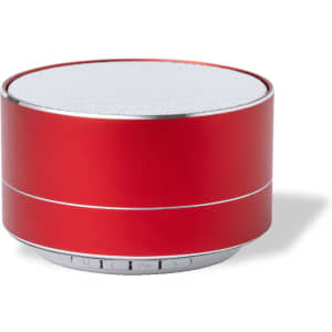 A red portable speaker with a silver mesh top and control buttons on the base. It features a logo on the side.