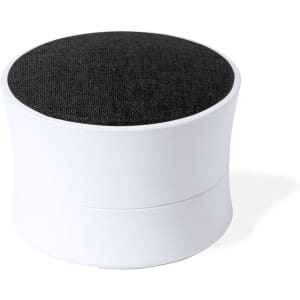 A compact speaker in white with a textured black top, featuring a smooth base and rounded shape.