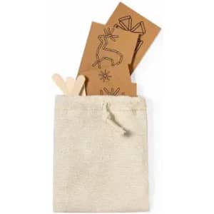 A small beige fabric pouch containing decorative brown cards and wooden sticks, featuring simple designs.