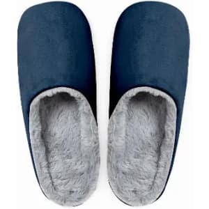 A pair of navy blue slippers with a soft grey interior. They feature a slip-on design for comfort.